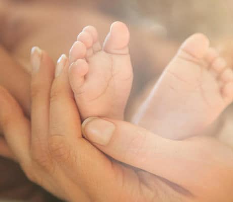 Natural baby cold remedies as chest and feet rub with essential oils.