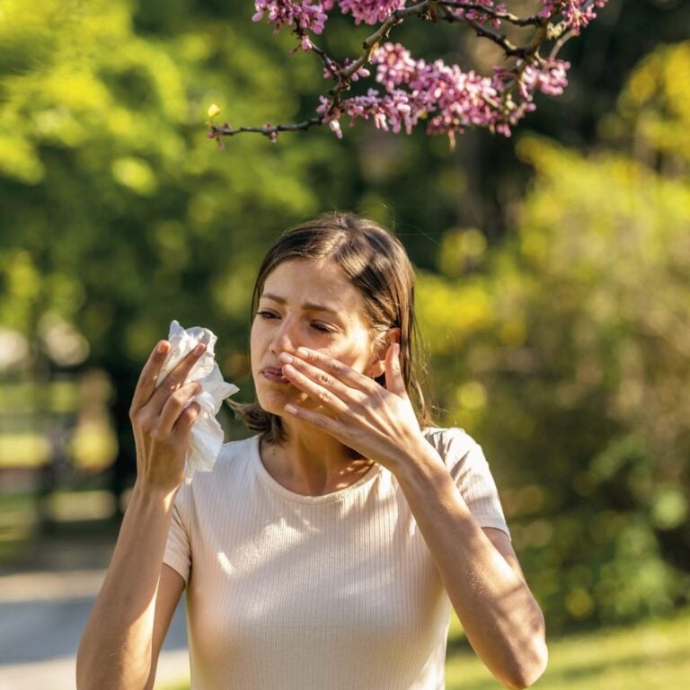 featured image showing person with allergy symptoms.