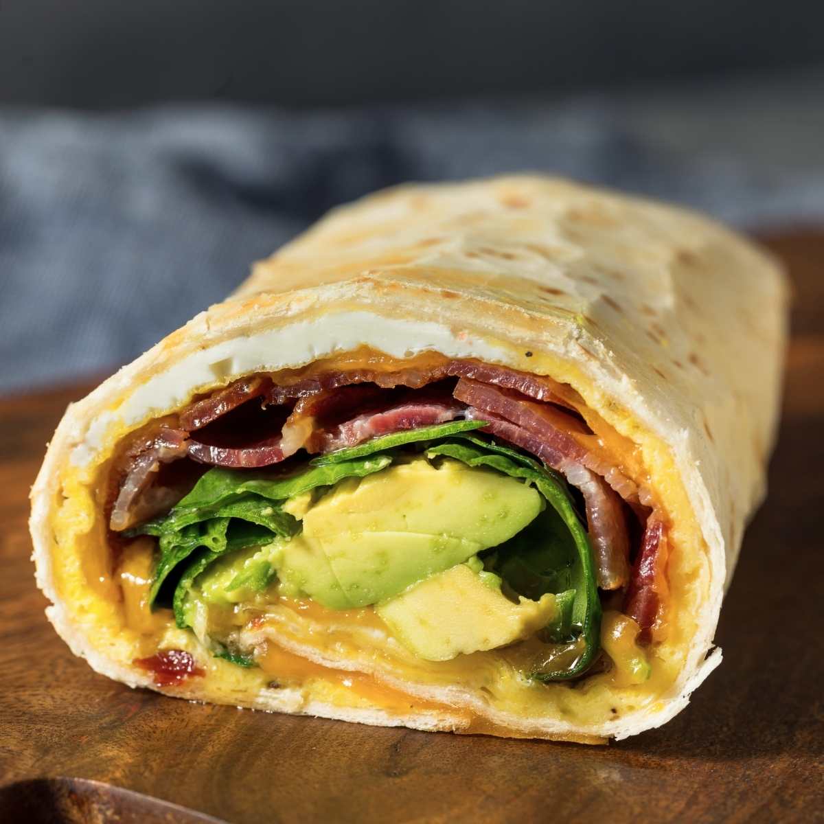 gf df breakfast burrito with egg greens avocado and bacon