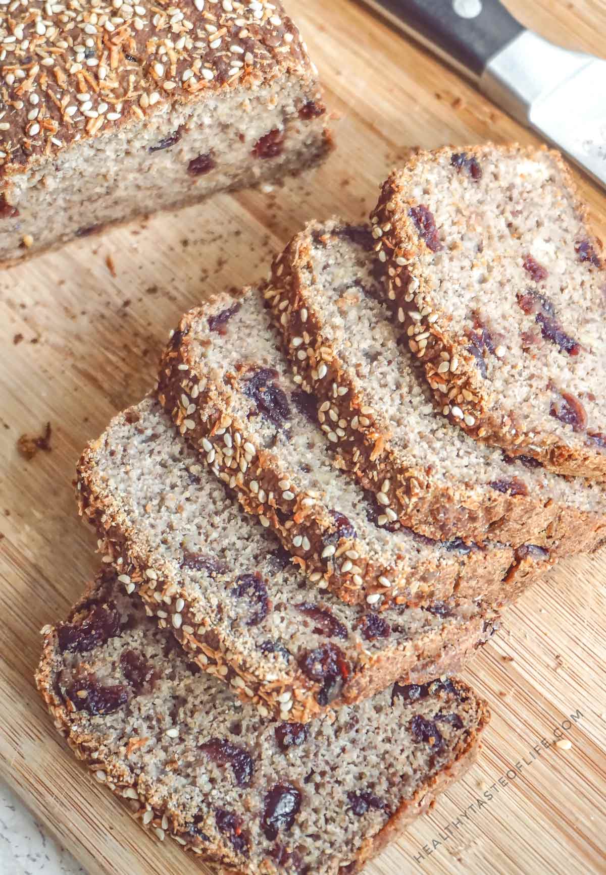 Vegan gluten-free sourdough banana bread loaf with sliced pieces naturally sweetened with bananas and dried fruit, No oil, no psyllium, no gums