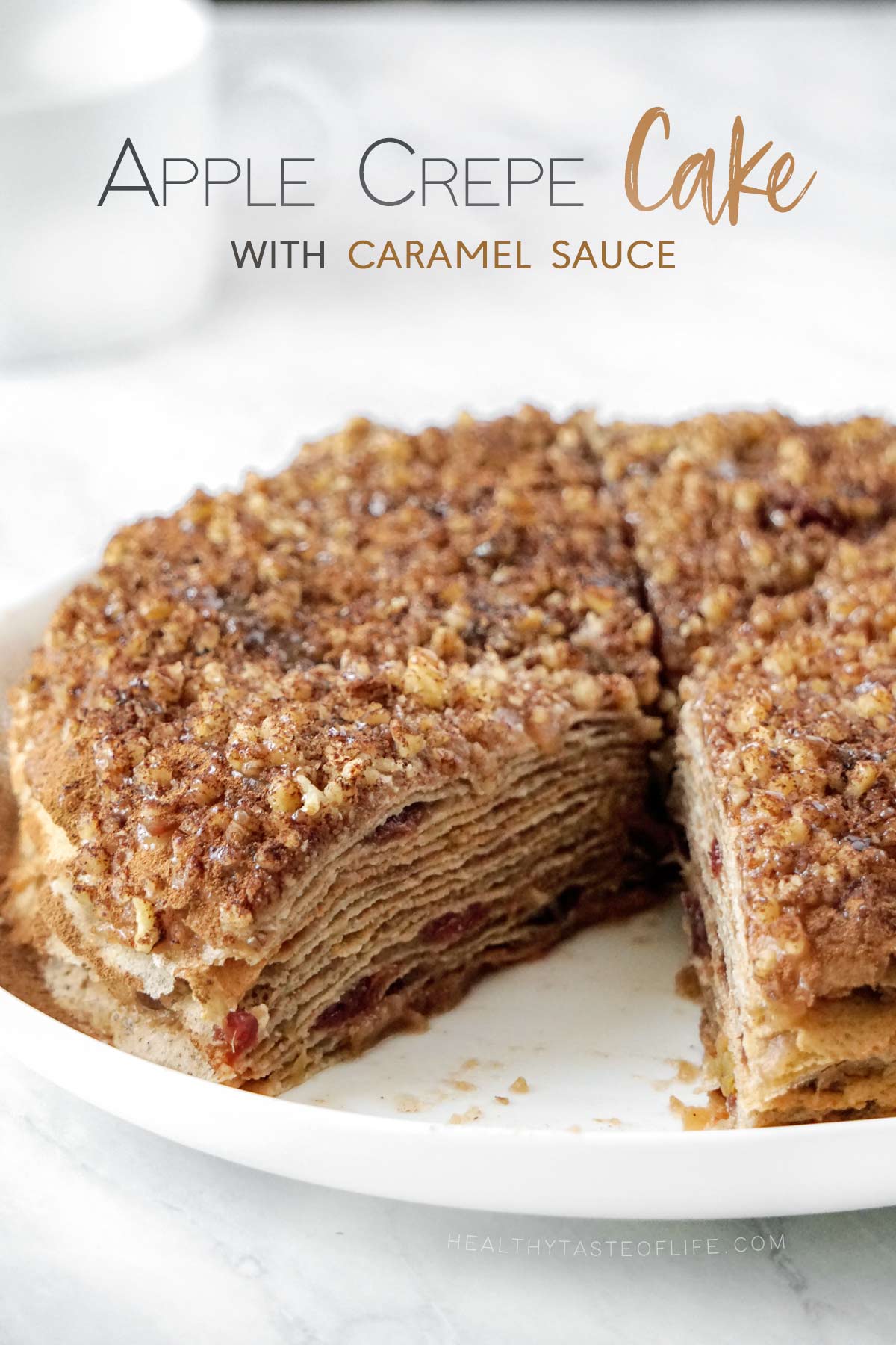 Apple crepe cake with thin gluten free crepe layers, cinnamon apple filling and dairy free caramel sauce