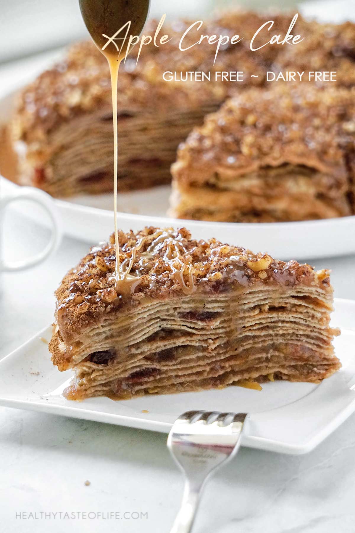 Slice of gluten free apple crepe cake showing layers of crepes and cinnamon apple filling