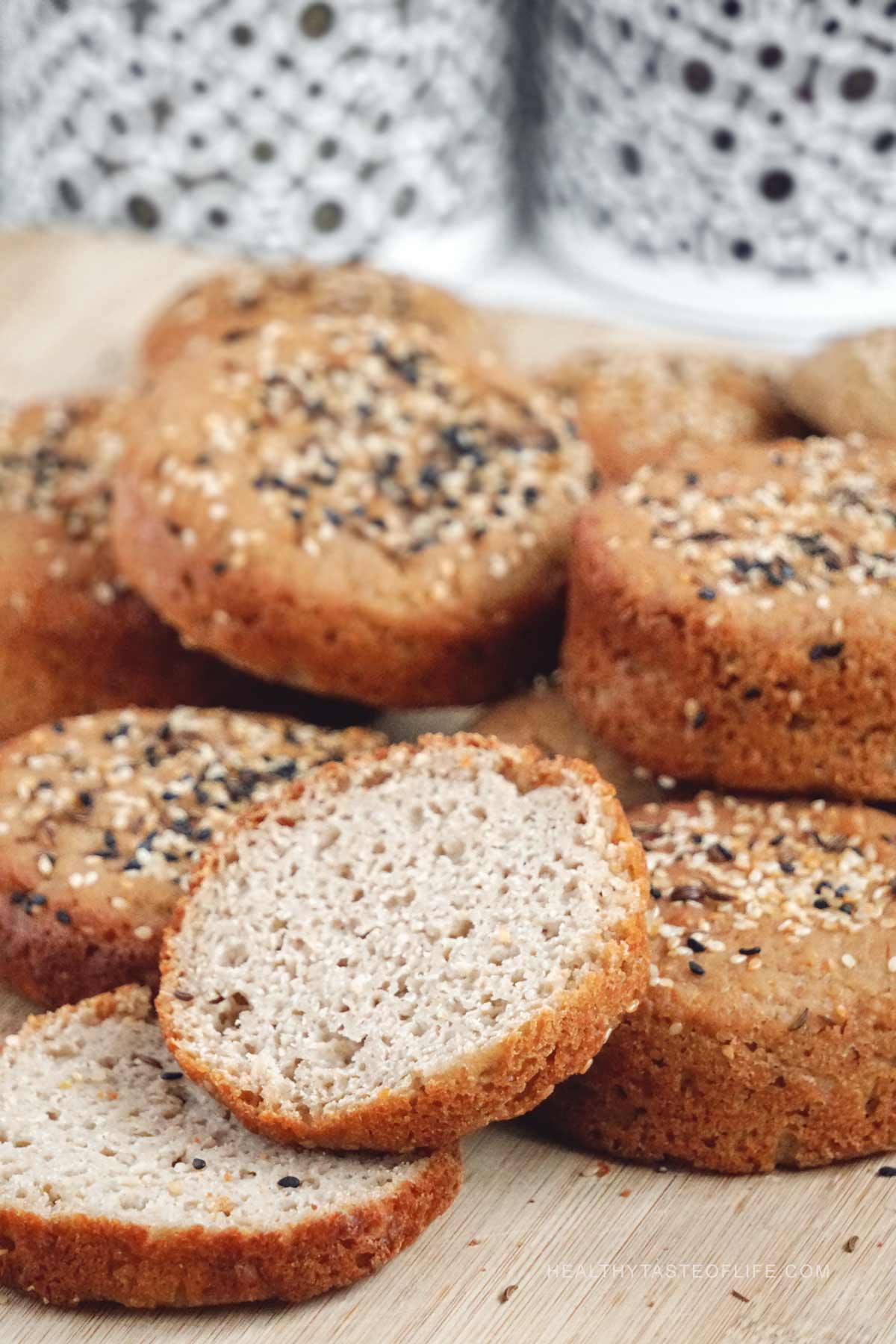 Vegan gluten-free sourdough buns with crusty exterior and soft interior sliced showing texture inside