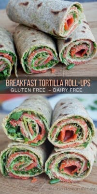 Healthy gluten free tortilla roll-ups assembled with smoked salmon, a dairy free avocado sauce and herbs. These gluten free breakfast roll ups are great as a quick clean eating breakfast on the go or can be cut into pinwheels and served as an appetizer or a filling snack.