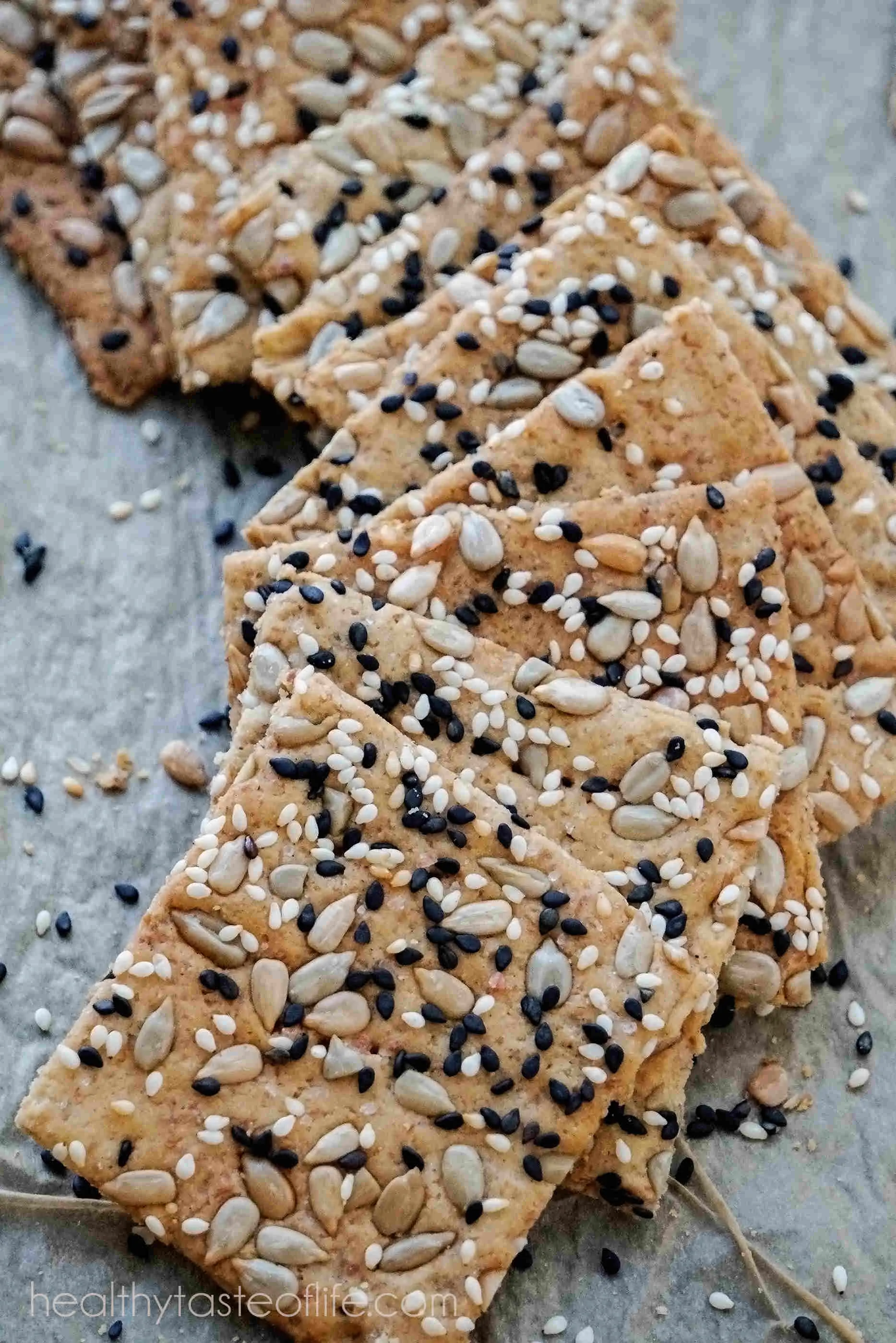 This homemade gluten free crackers recipe uses a mix of gluten free flours including rice flour and a variety of seeds. 
