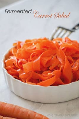 A very easy and healthy Paleo, Whole 30, and Vegan Carrot Salad made with fermented shaved carrots and a mix of spices. A probiotic-rich, tangy and fragrant carrot salad that can be served as a side dish or topping.