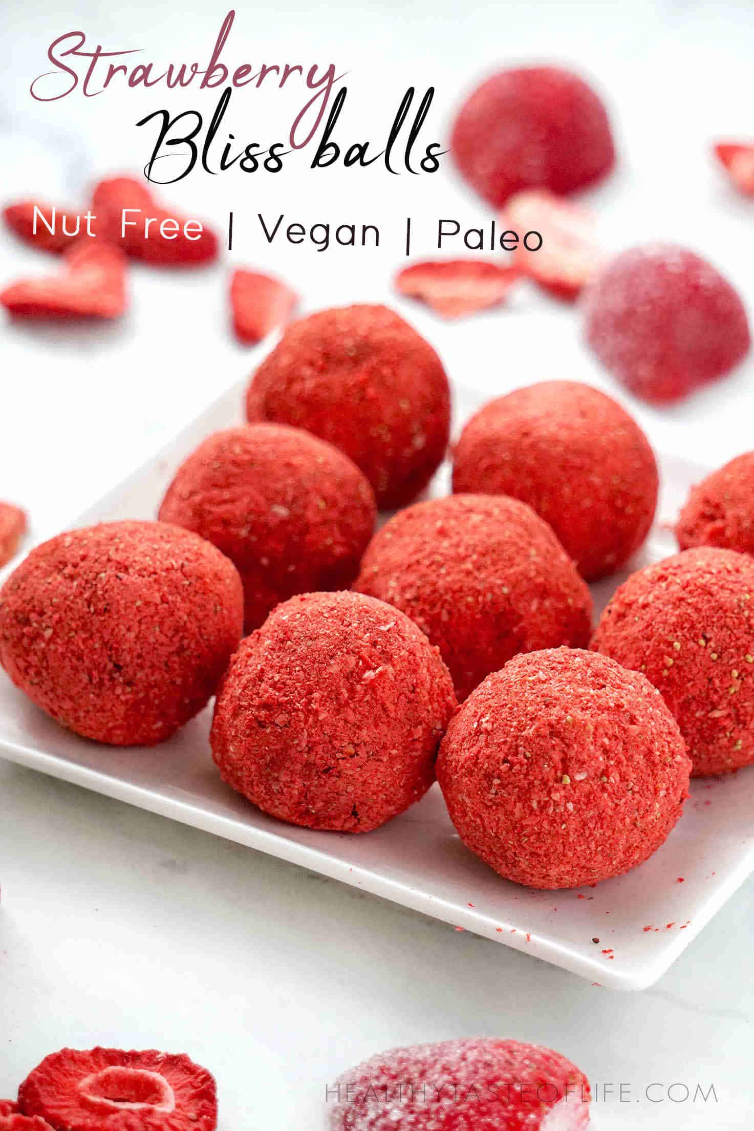 Healthy Strawberry bliss balls - nut free, gluten free, vegan - full of fiber, healthy fats, protein and strawberry flavor! These healthy strawberry bliss balls are the perfect no bake, raw vegan, paleo snack or breakfast you can have on the go. The recipe for these nut free, gluten free and sugar free strawberry bliss balls is easy to make and is “clean eating” friendly.