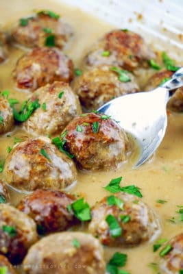 Easy healthy Swedish Meatballs made with a blend of seasoned ground turkey and beef baked in the oven and tossed with a creamy dairy free gravy / sauce. Tasty and easy dairy free / gluten free Swedish meatballs recipe that saves time and reduces dirty dishes. How-to video included!