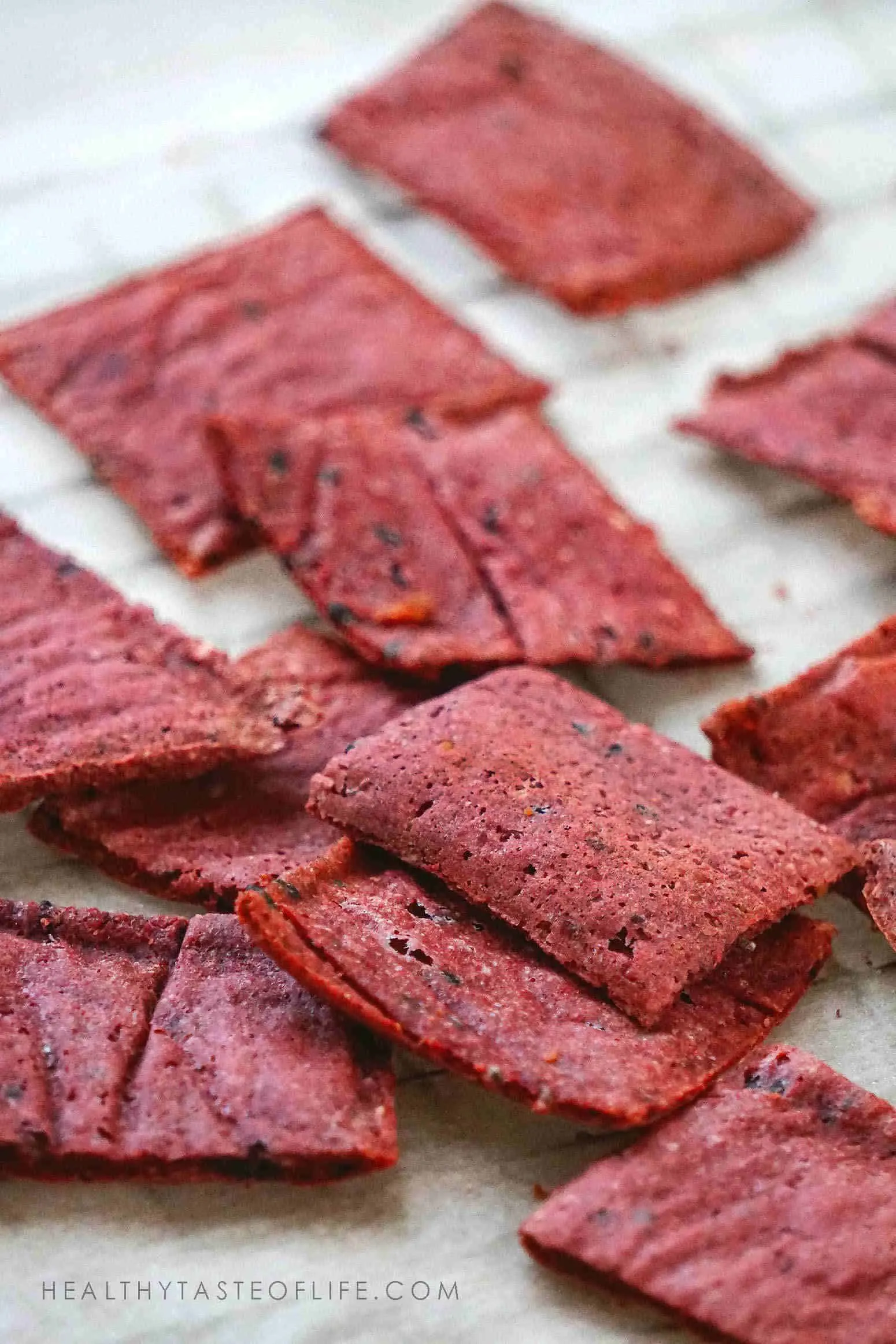 Homemade gluten free crackers with beets and seeds