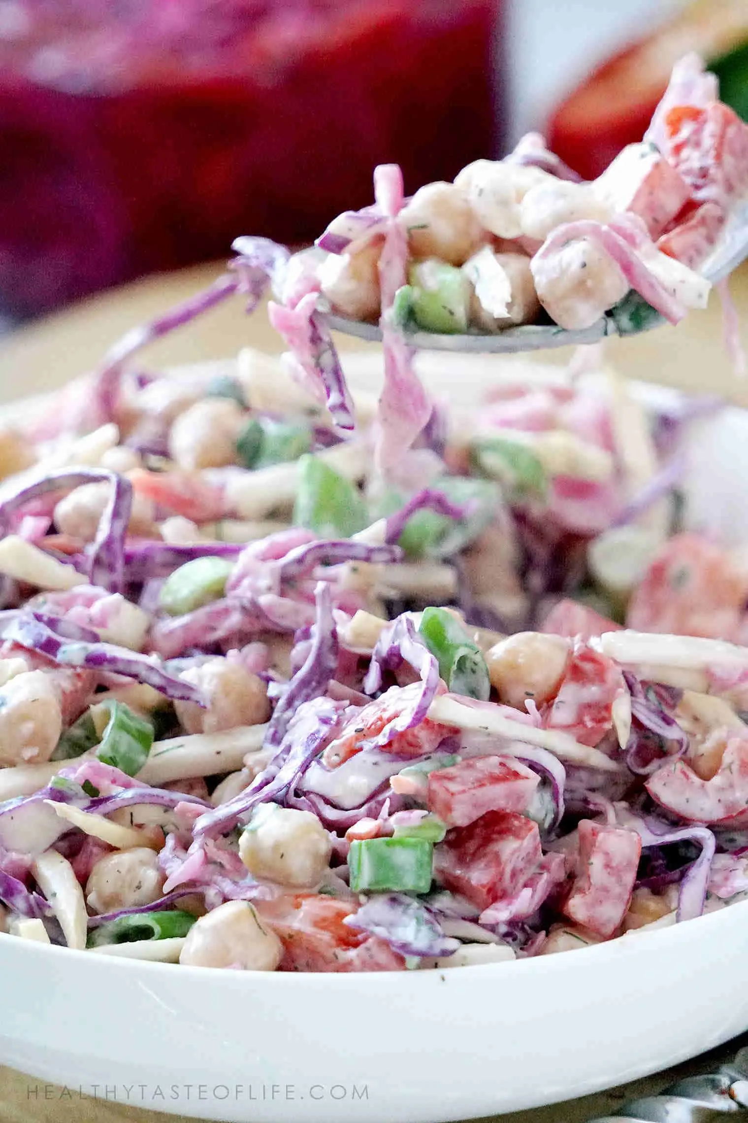 Creamy garbanzo bean salad with cabbage, celery root, bell peppers, onion and a creamy ranch dressing - all vegan.