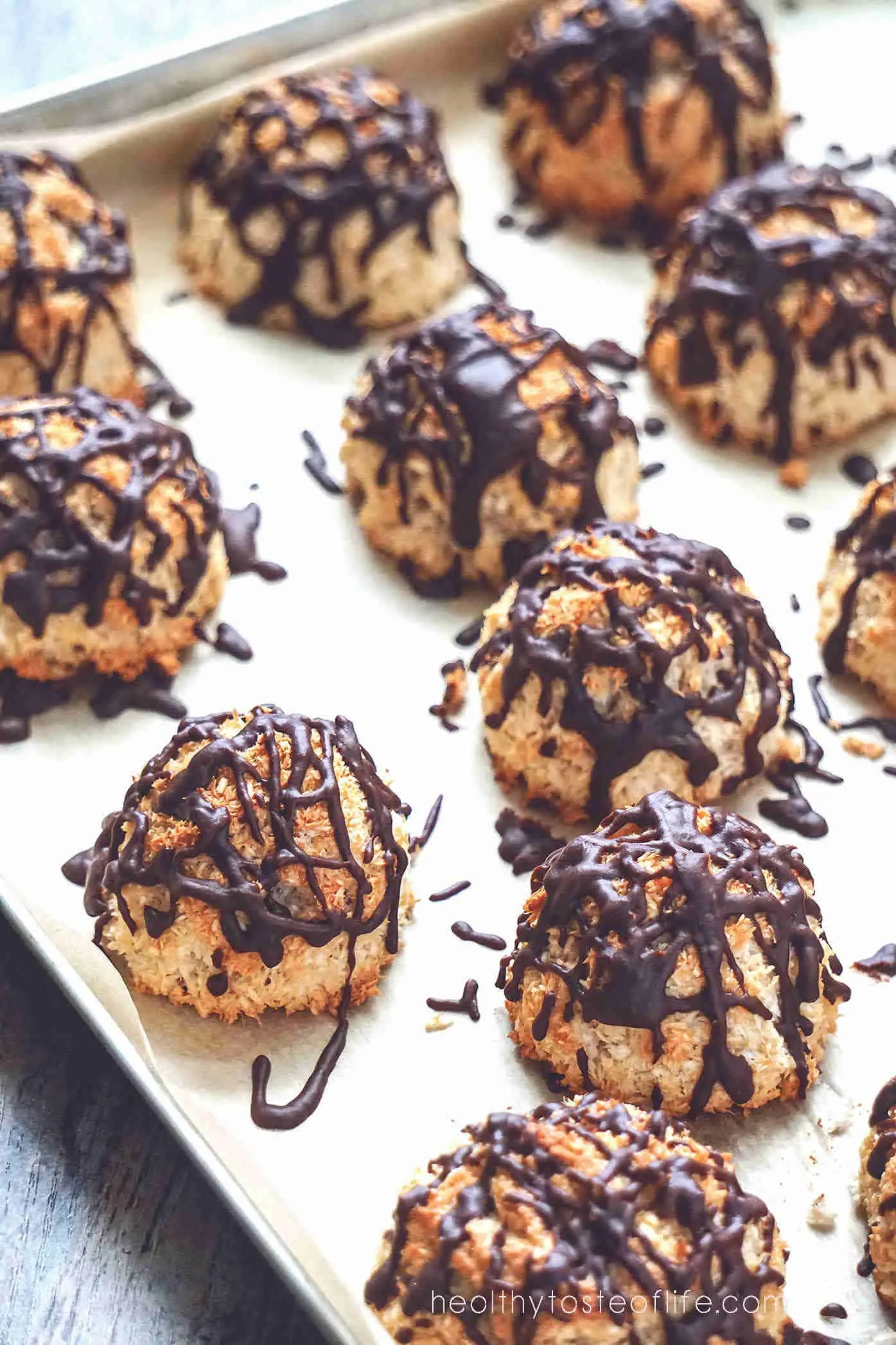 Overhead shots of baked dairy free gluten free coconut macaroon recipe without condensed milk, drizzled with chocolate.