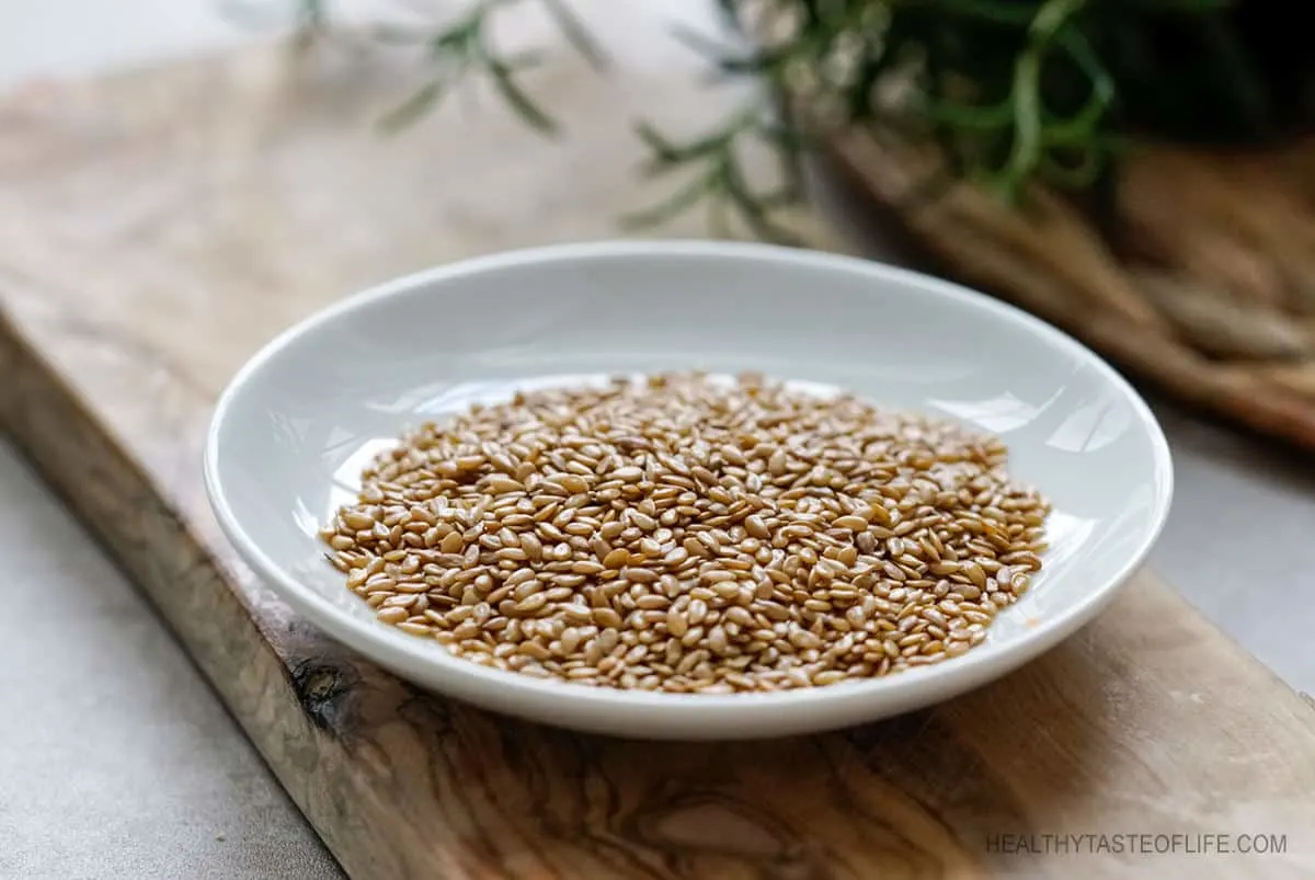 Golden whole flax seeds on a plate