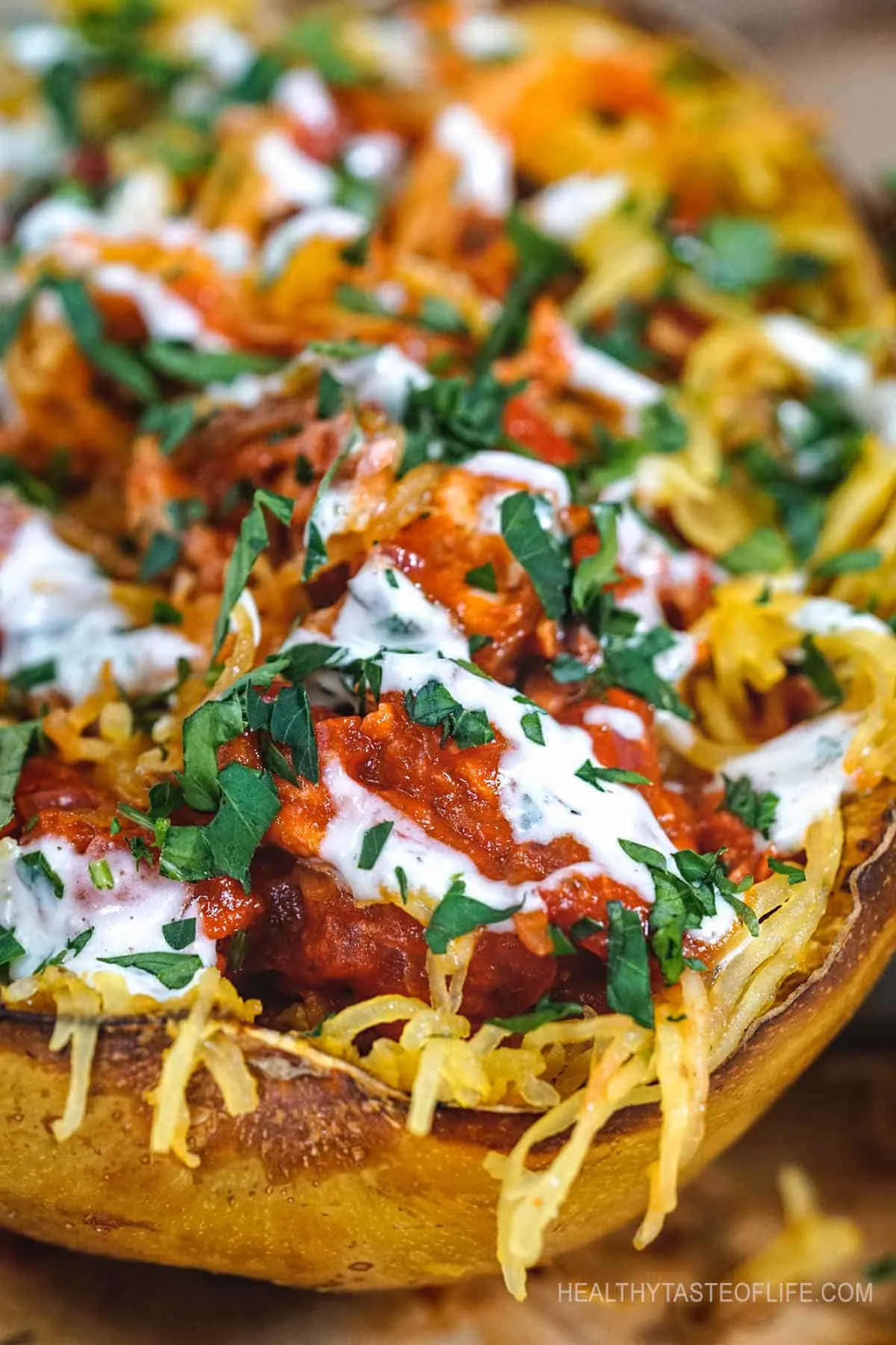 Looking for paleo spaghetti squash recipes with chicken? Try this paleo chicken and spaghetti squash boats loaded with wholesome ingredients and tossed in a flavorful paleo friendly BBQ sauce a delicious lunch or dinner made with only whole foods! Customize the recipe and pair the paleo spaghetti squash boats with other sauces, meats, seafood or transform into a casserole. #paleospaghettisquash #paleodinner #paleolunch #paleochicken
