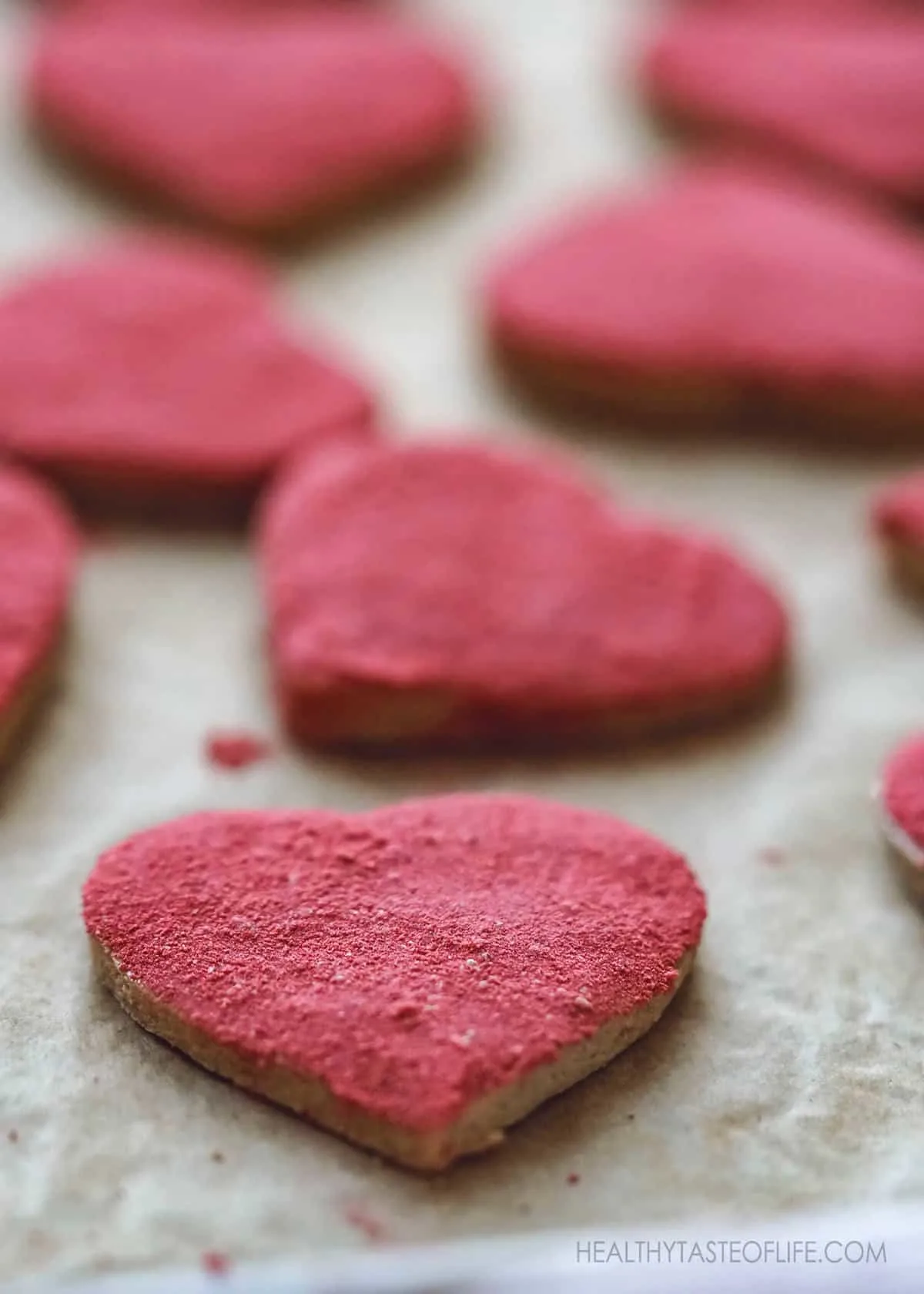Close up shot of gluten free vegan Valentines Cookies With Strawberry decoration.