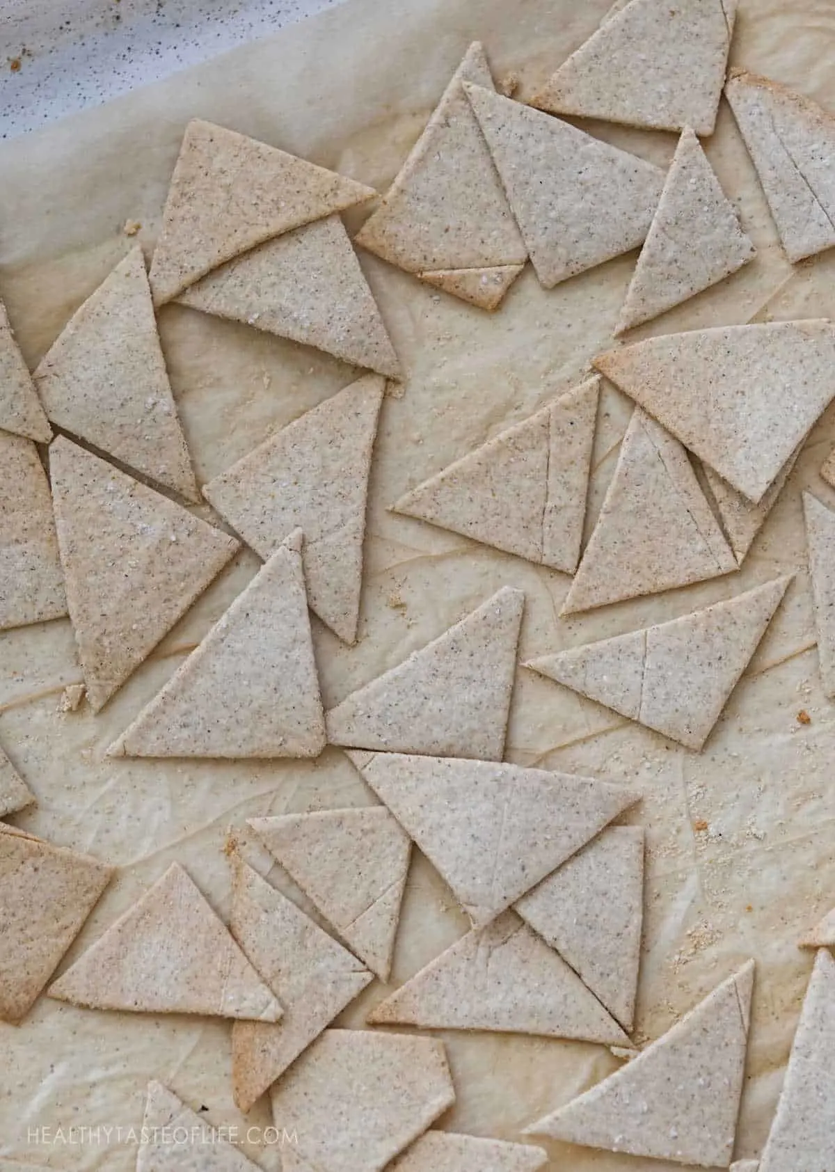 Grain free cassava crackers on a cookie sheet.