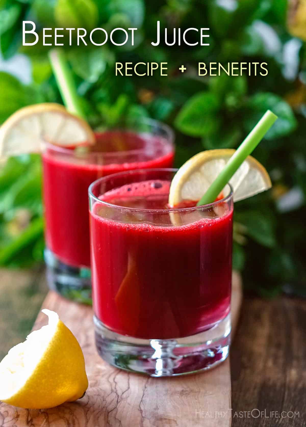 Picture showing fresh beetroot juice served in two glasses with straws and garnished with a slice of lemon.