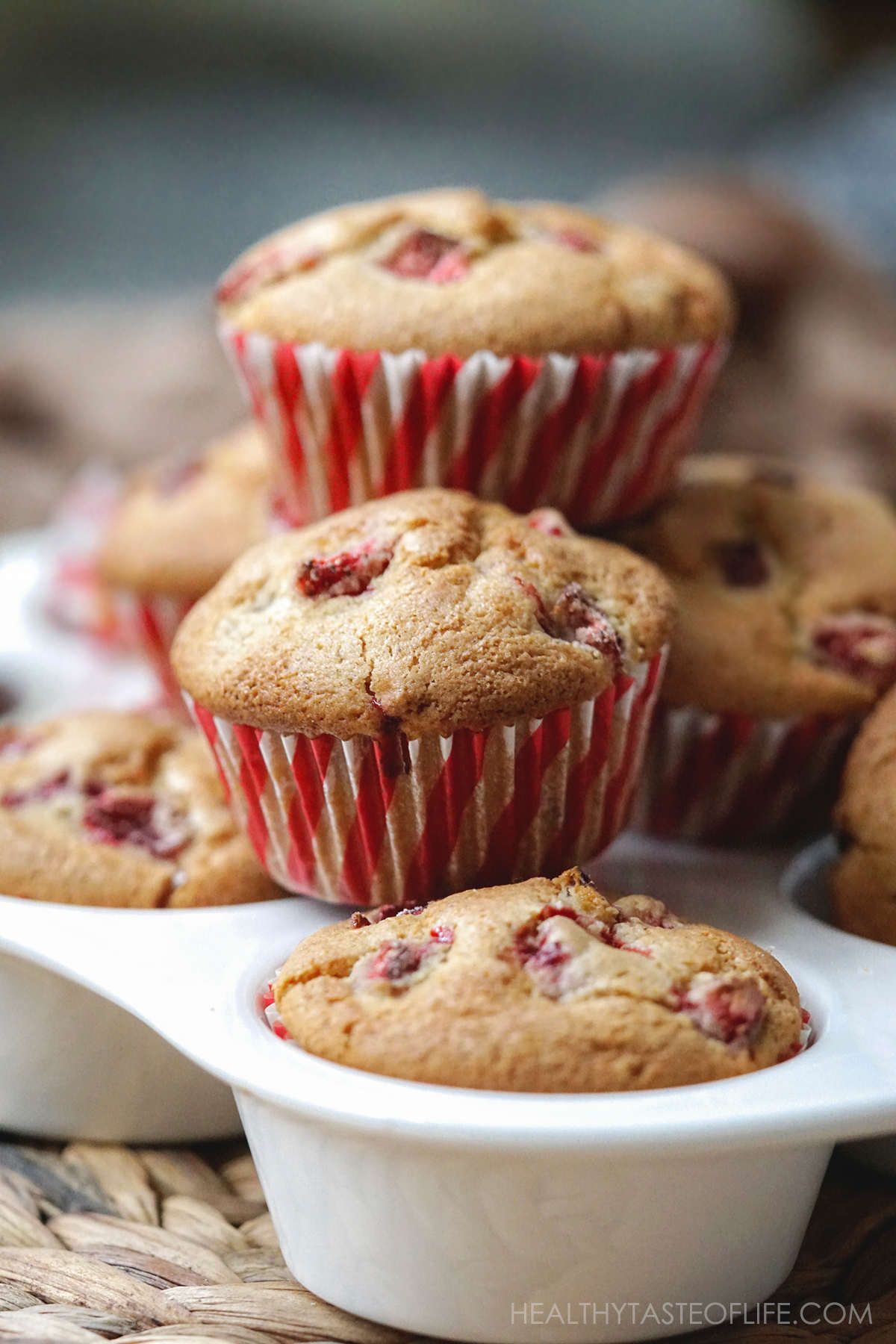 Gluten Free strawberry muffins recipe stacked on each other.