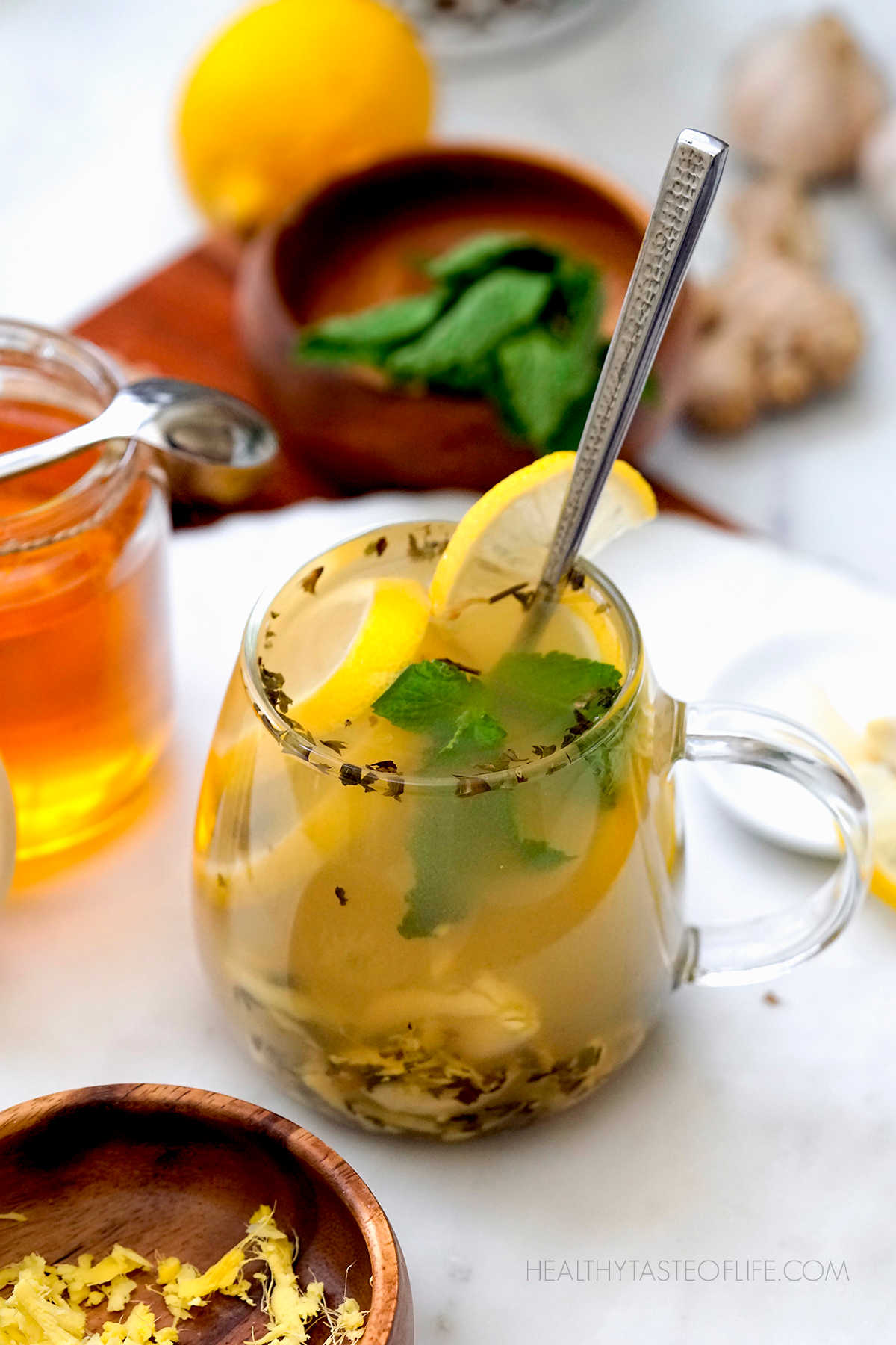 Best tea for cold and flu - flu bomb drink with with lemon honey ginger garlic. Immunity booster drink.