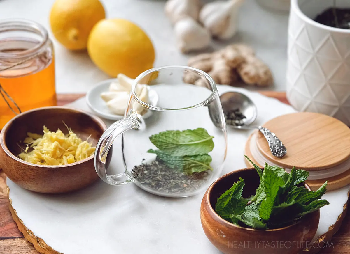 Ingredients prepared for making the flu bomb tea - lemon ginger garlic honey drink.
