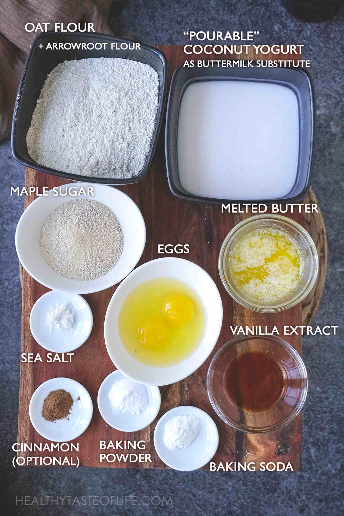 Measured oat flour pancakes ingredients displayed on a board.