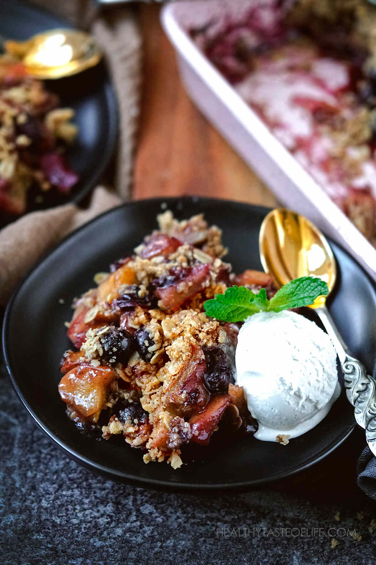 Healthy apple and berry crumble with dairy free coconut ice cream.