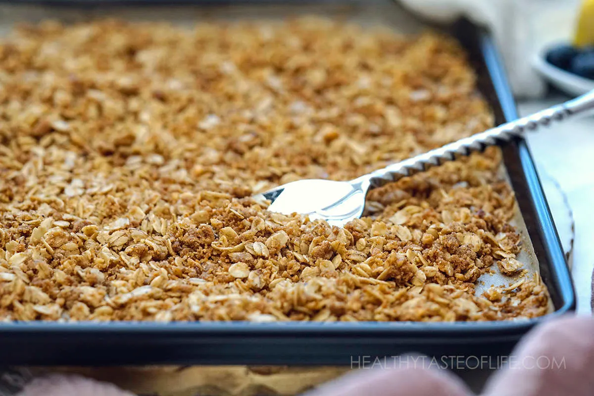 Baked oat crumble topping with a sandy texture, to be used as granola.