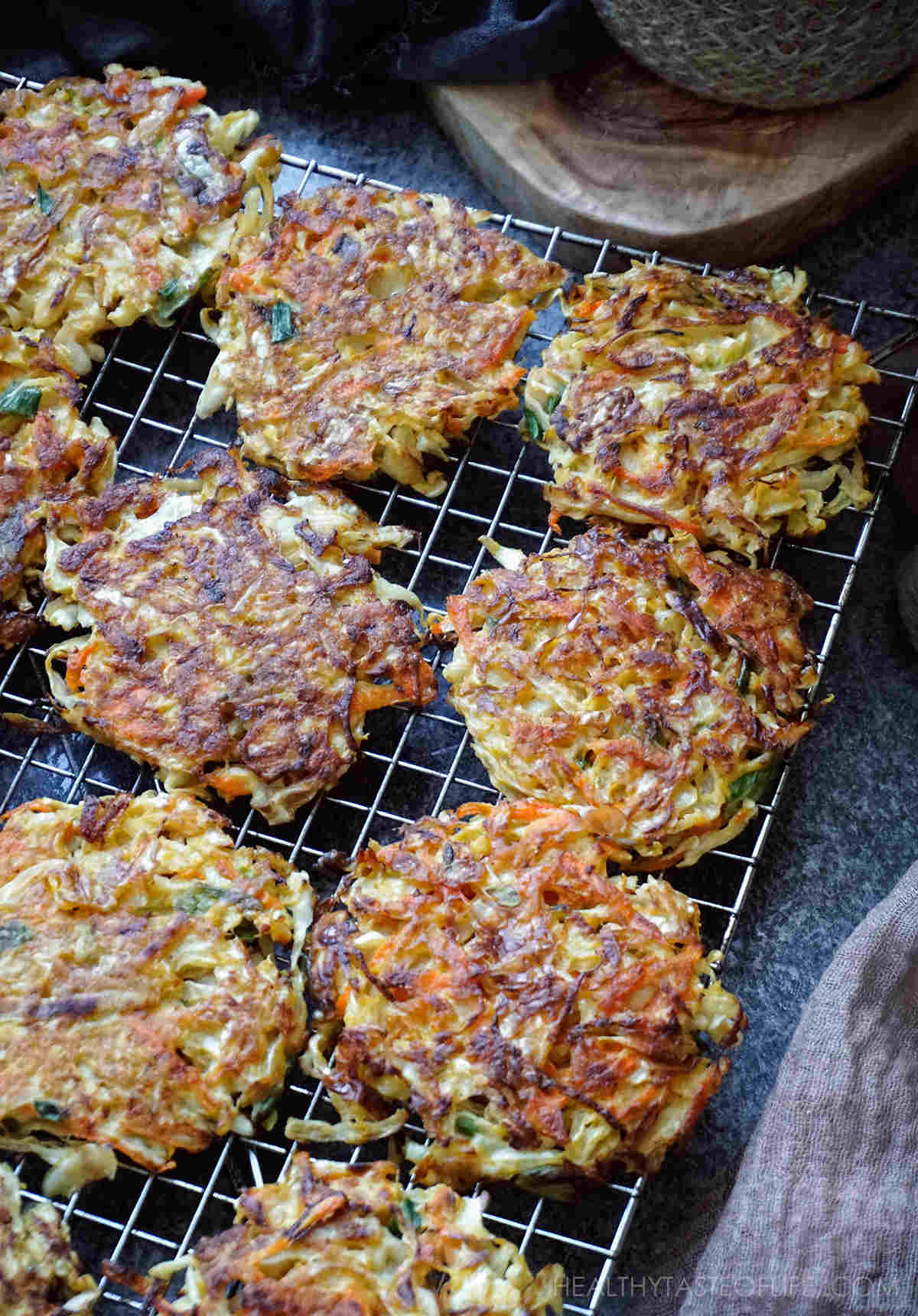 Cooling cabbage fritters, cabbage pancakes or cabbage patties on a rack.