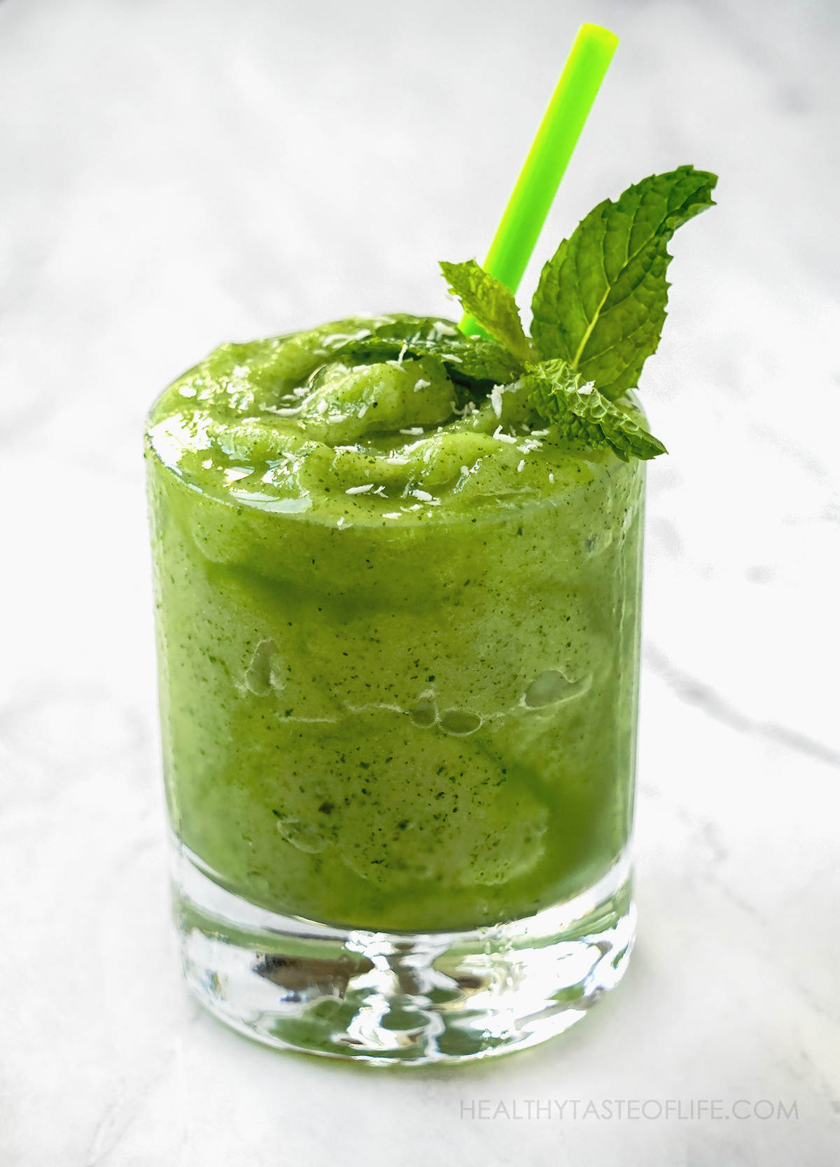 Homemade honeydew drink recipe thick and cold as a smoothie with a slush consistency.