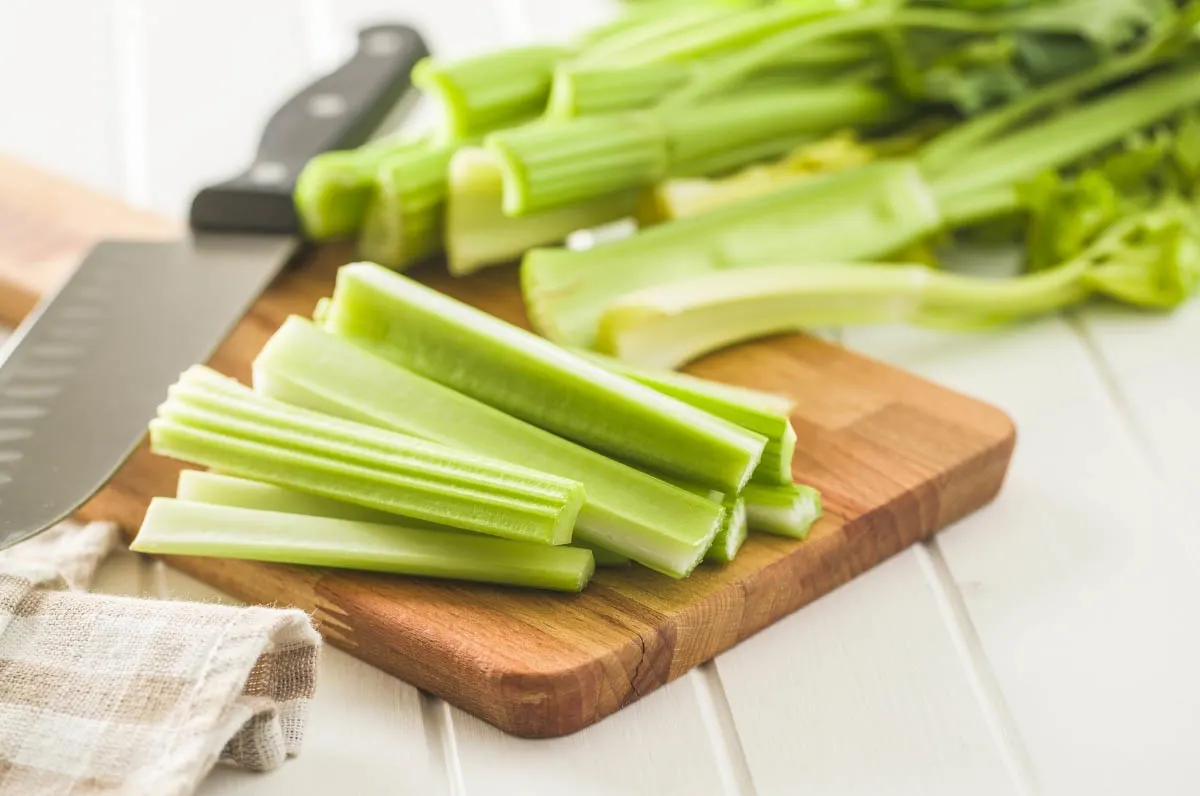 Celery cutting on a board.