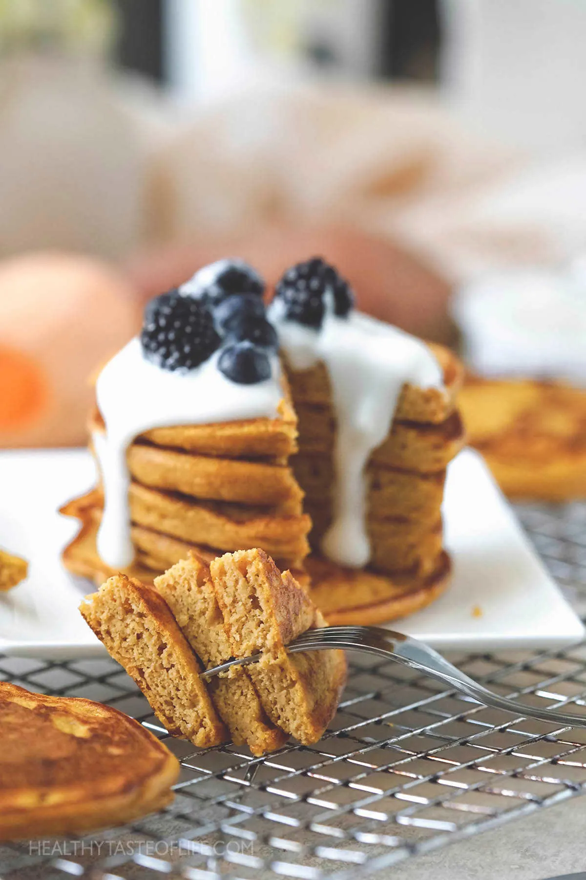 Fluffy potato pancakes served with yogurt and fruit.