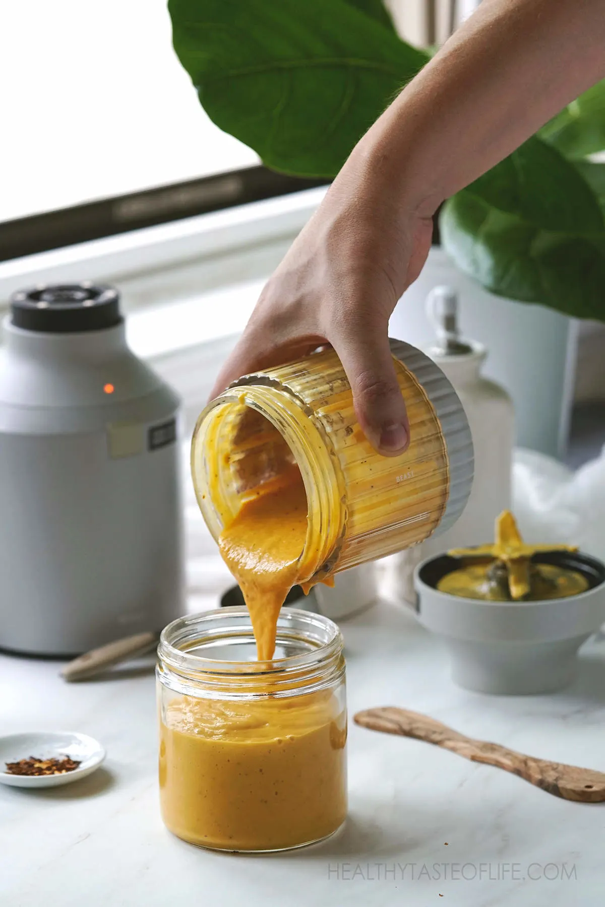 Pouring mango sauce from blender, great for chicken and fish.