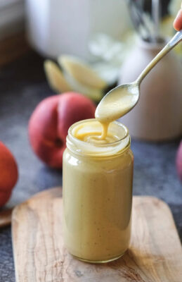 Peach salad dressing with vinegar, creamy and smooth made with peach, oil, vinegar and mustard.