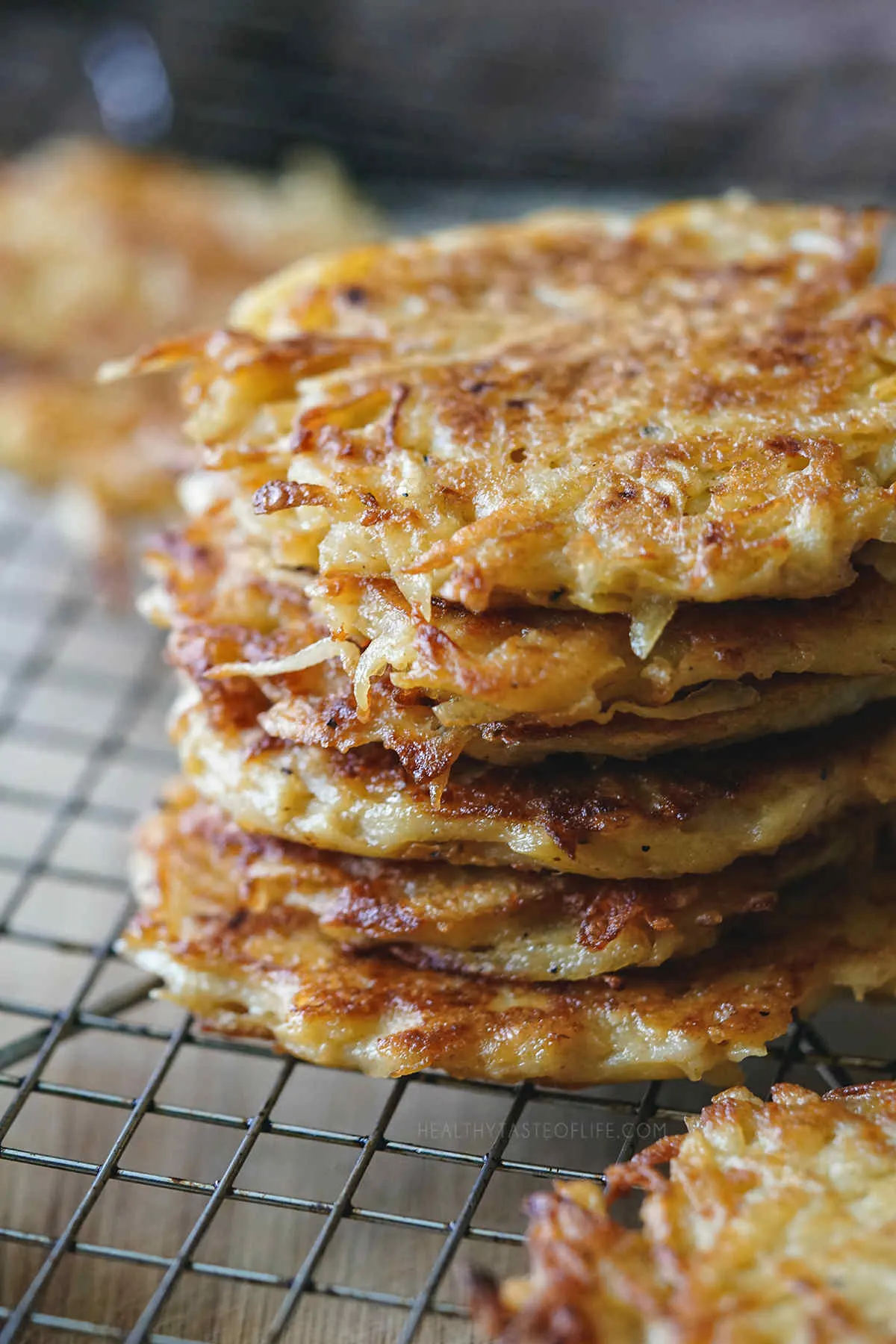 Stacked grated potato pancakes or fritters.