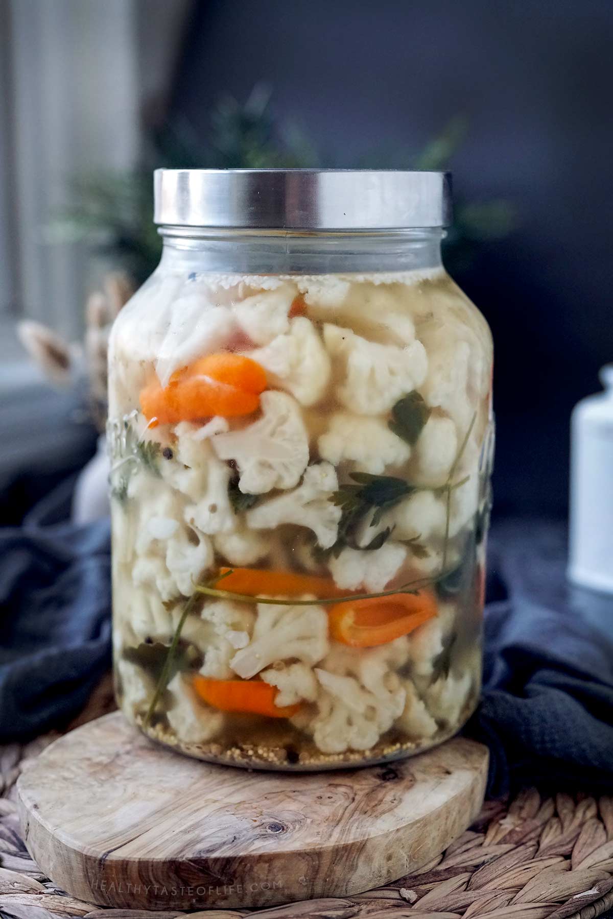 The same jar with fermented cauliflower after 3 weeks in the refrigerator showing how it should look once fermented.