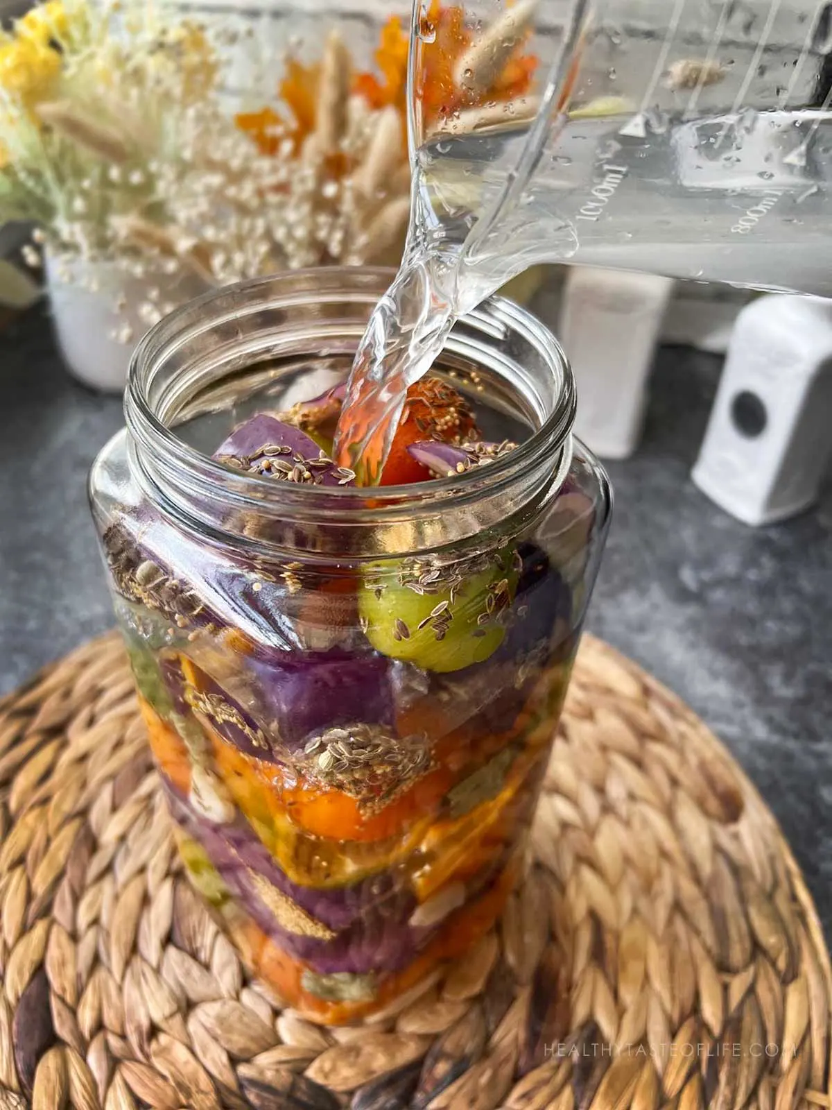 pouring brine over the veggies