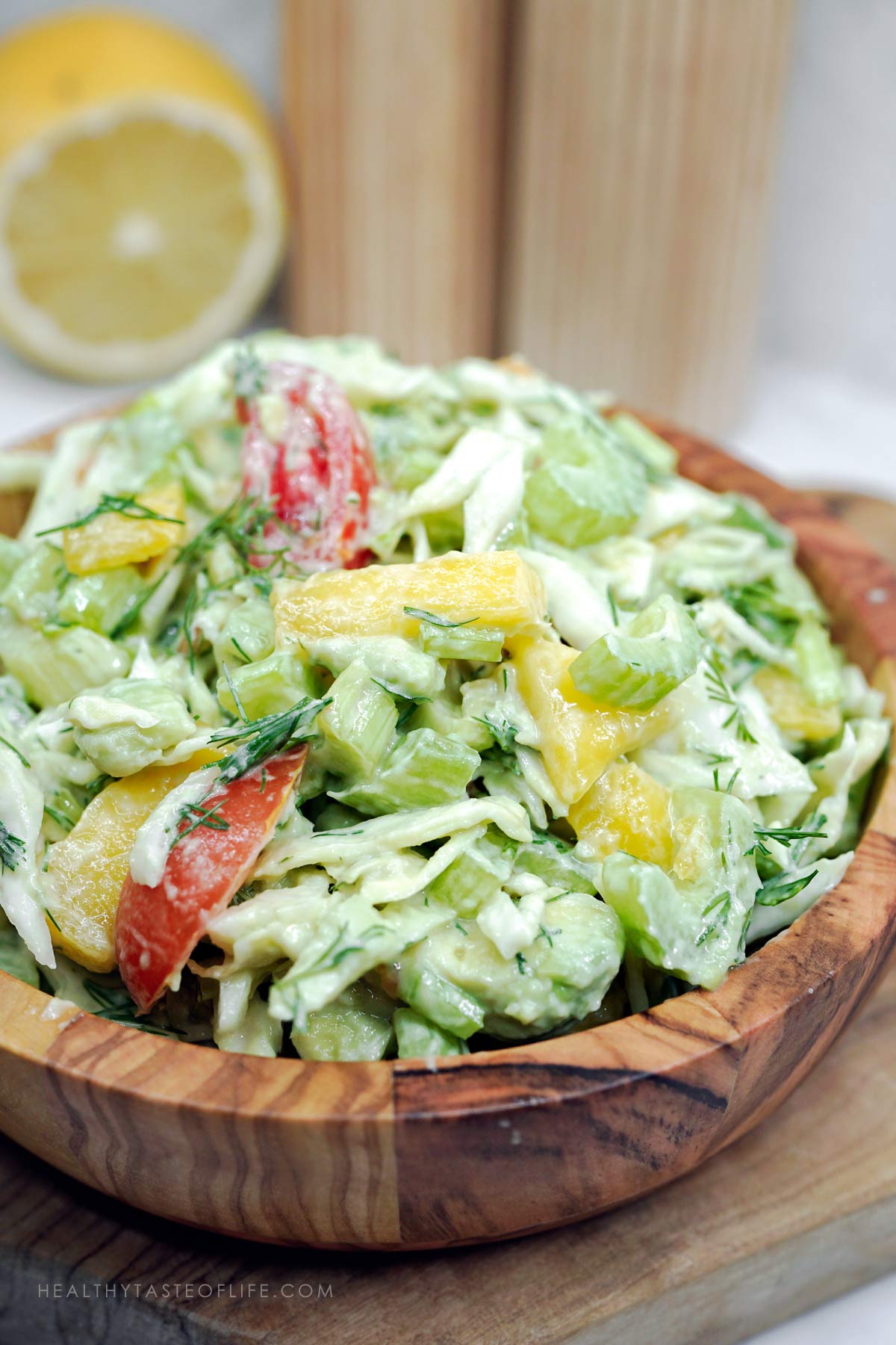 Fibre-rich salad with celery, cabbage, mango, avocados, cherry tomatoes, and creamy dressing.