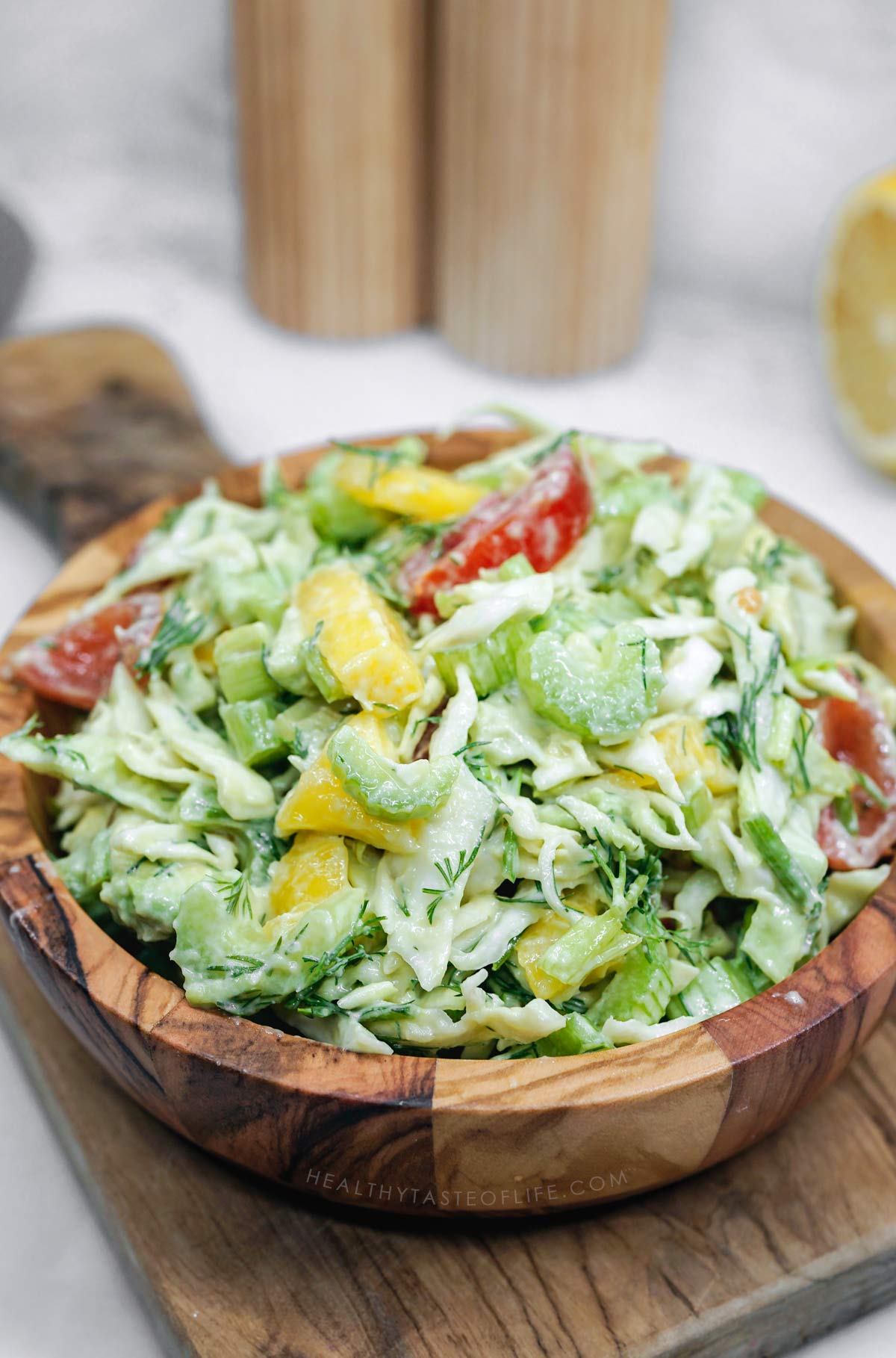 High fibre salad with celery, cabbage, mango, avocados, tomatoes, and creamy dressing.