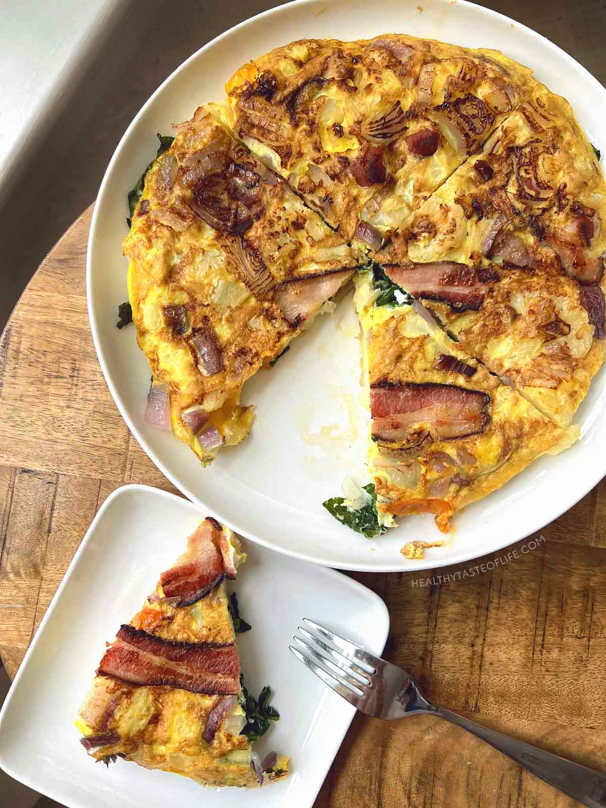 Healthy breakfast omelette low carb with veggies above shot slice cut out.