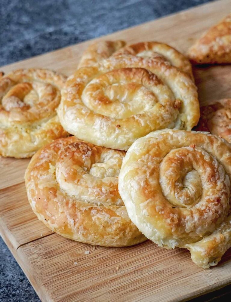 Golden, flaky savory cheese puff pastry pinwheels spirals rolls