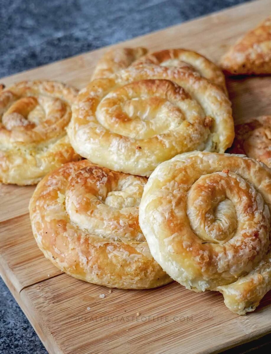 Golden, flaky savory cheese puff pastry pinwheels spirals rolls