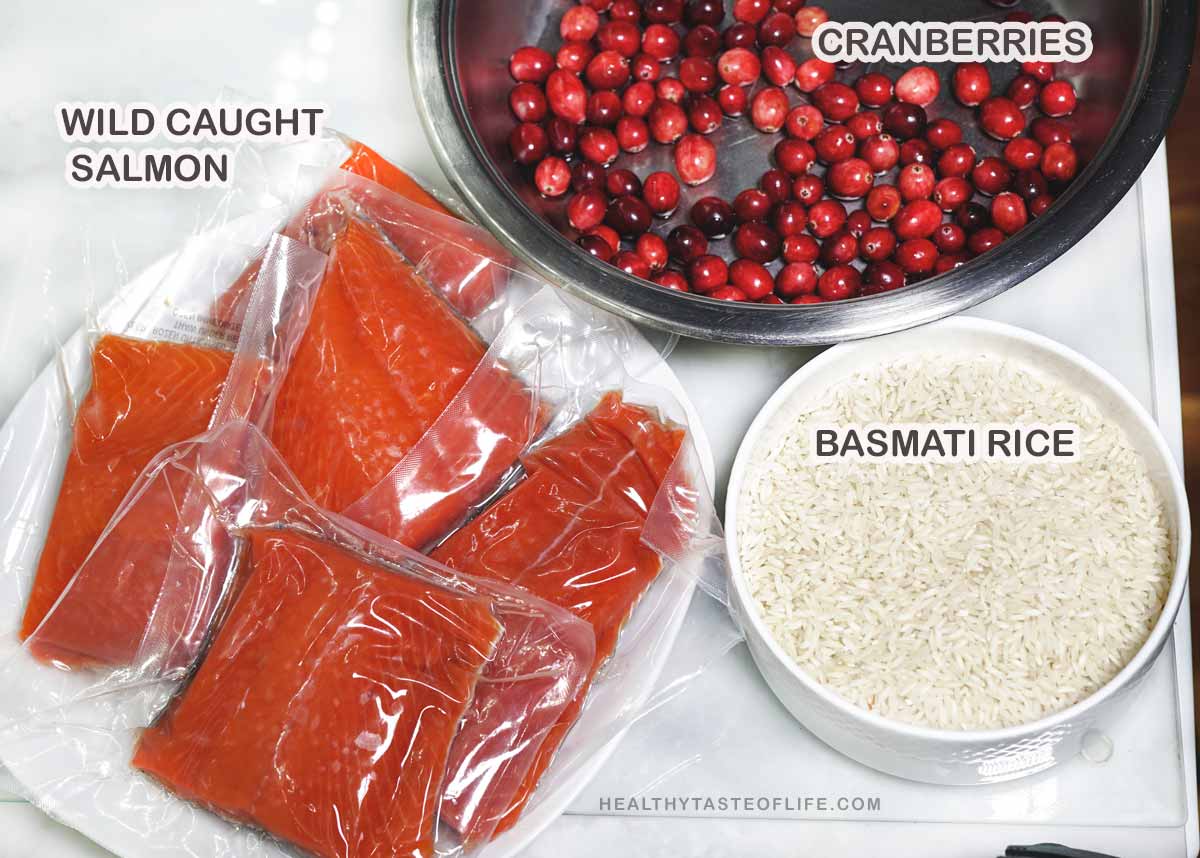 Ingredients salmon, rice, cranberries on the table,