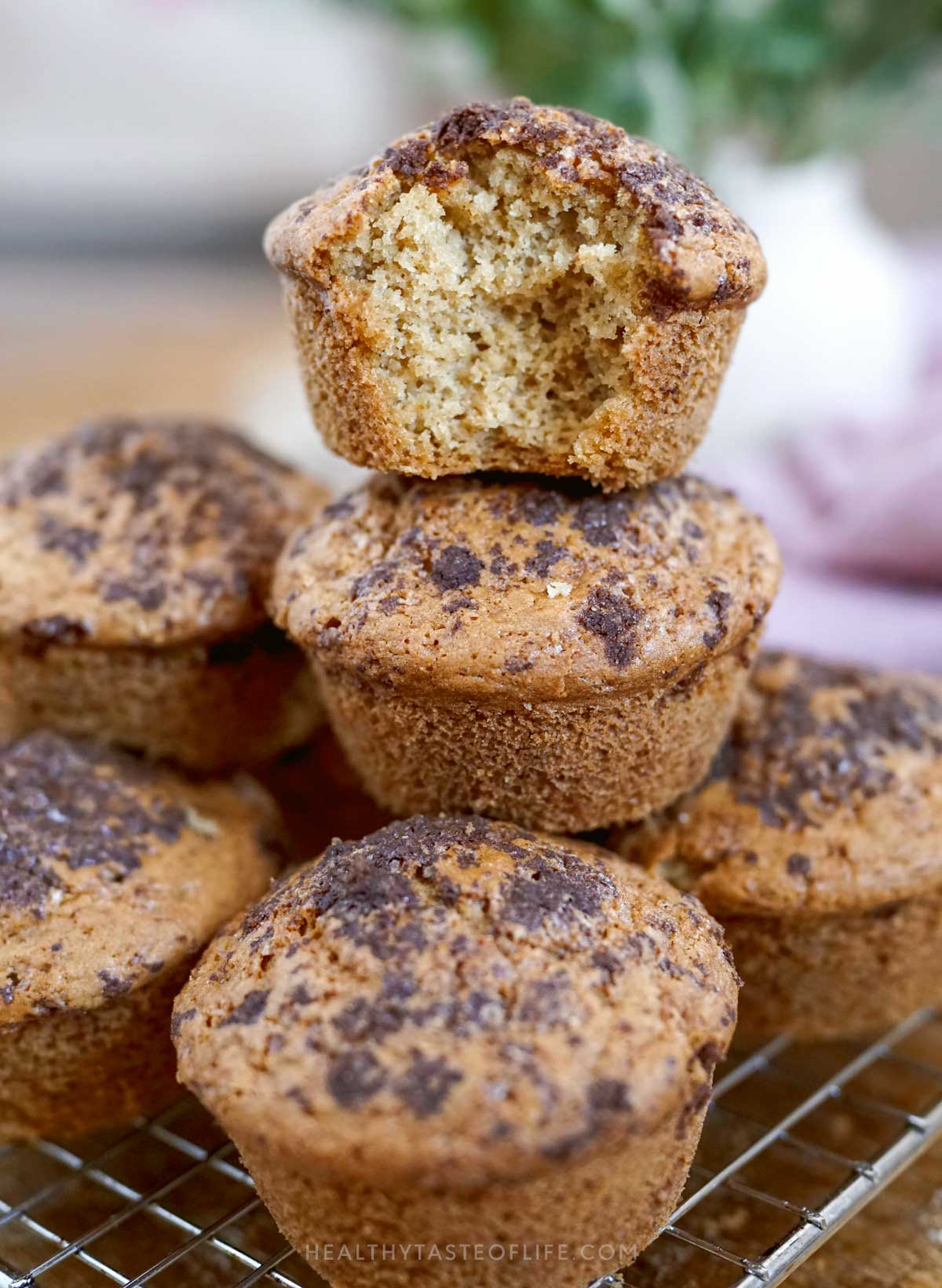 moist gluten free dairy free yogurt muffins soft inside, bitten showing texture inside