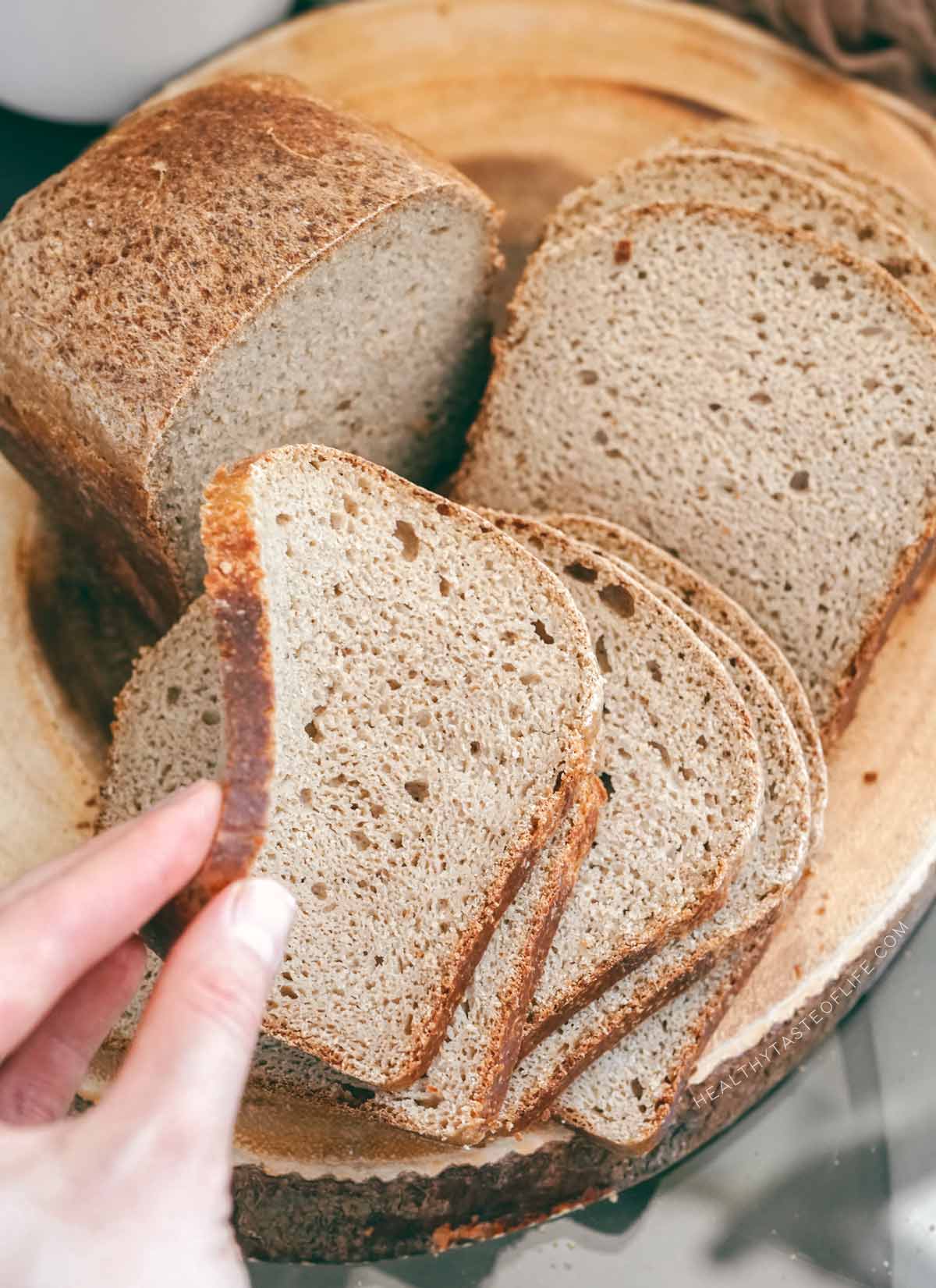 Flexible crumb of gluten-free sourdough bread without xanthan gum: sliced evenly for toast showing cohesive interior and elasticity