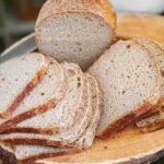 Thin flexible slices of gluten-free sourdough bread showing crub texture inside