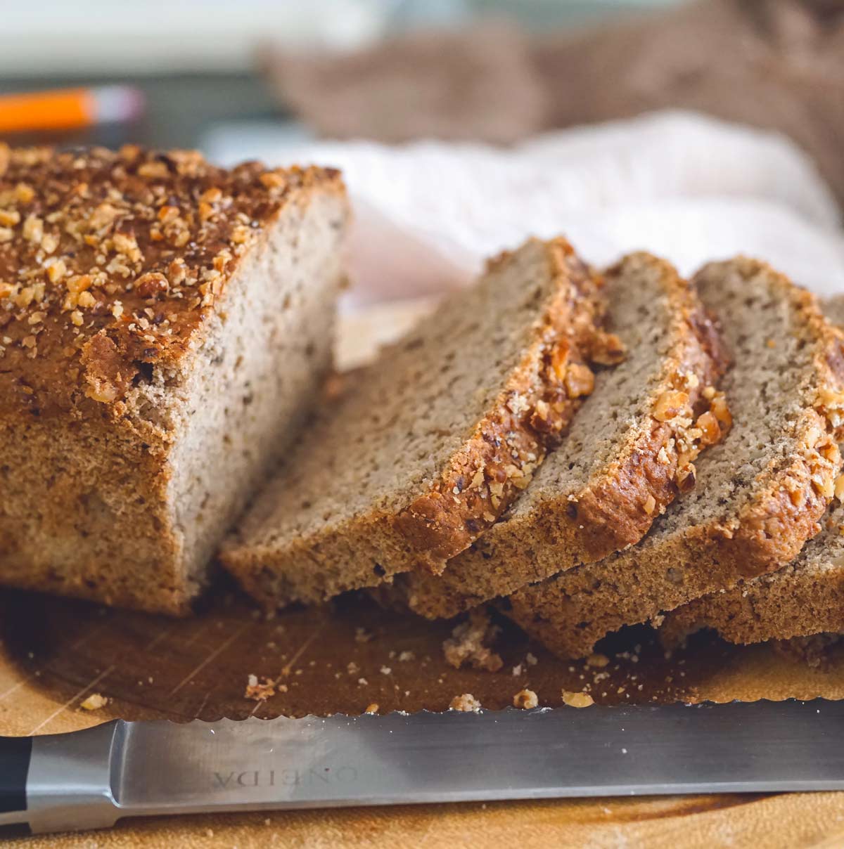 Gluten free sourdough banana bread with dairy free yogurt half sliced.,